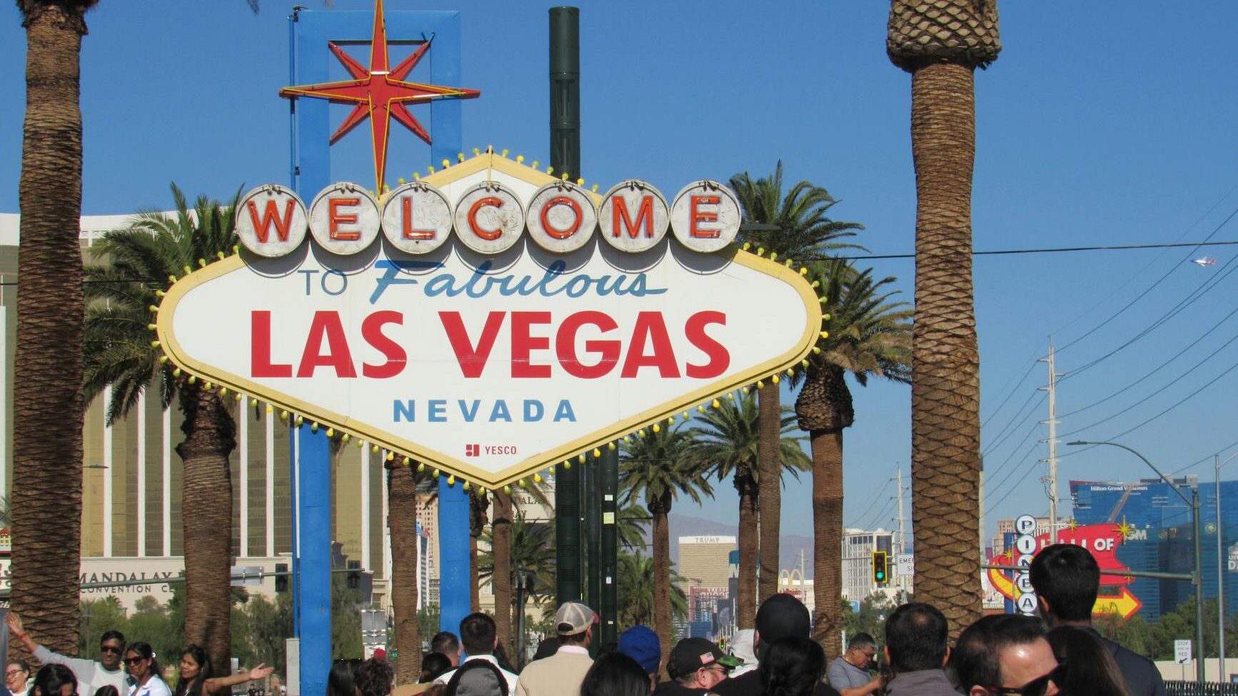 iconic welcome to las vegas sign with crowd
